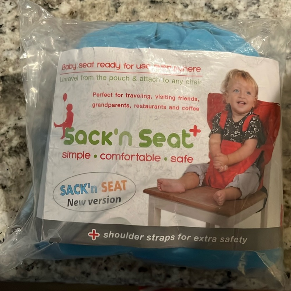 Sack N Seat, traveling baby seat. New, not opened. Color blue. Non-smoking home